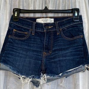 Distressed blue jean shorts